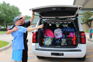 Noah Lawyer takes a "selfie" with Officer Pace.