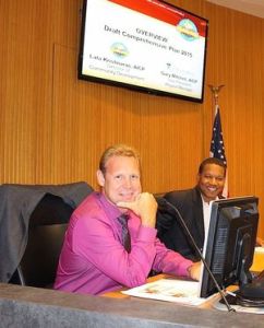 Councilmen Gary Moore and Derrick Reed trade laughs before the workshop.