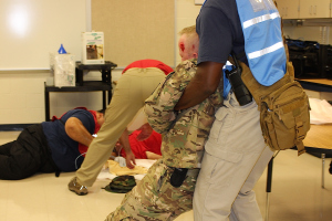 EMS personnel (in red vests) and police (in blue) worked together to secure the scene as quickly as possible.