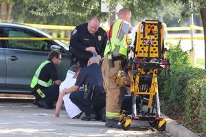 Medics with an unidentified person at the scene. (Photo: Kar Hlava)