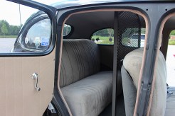 The "cage" in the back seat where suspects were transported